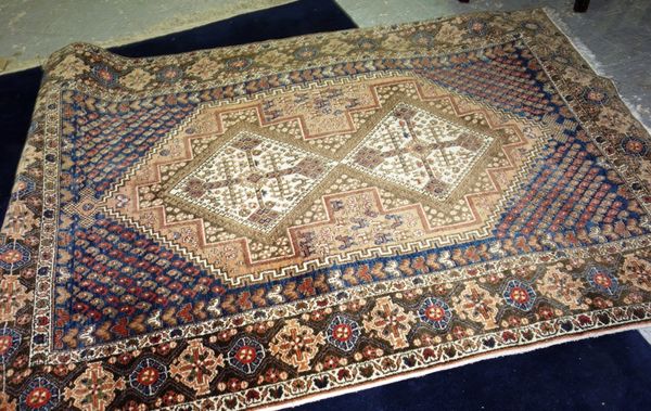A 20th century Persian style rug.   G8
