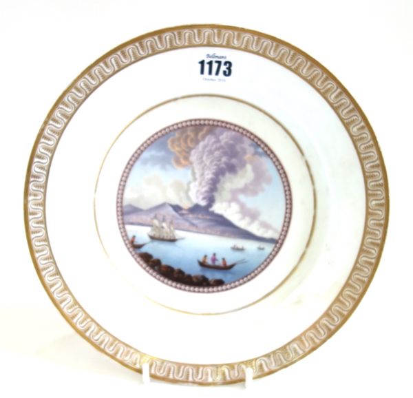 A Berlin porcelain plate, early 19th century, well painted with a view of Mount Vesuvius erupting , titled in black script `Eruption du Vesuve, le 18.
