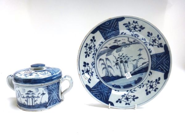 A Dutch Delft blue and white cylindrical posset pot and cover, mid 18th century, painted with an interpretation of the `Three Friends of Winter', pine