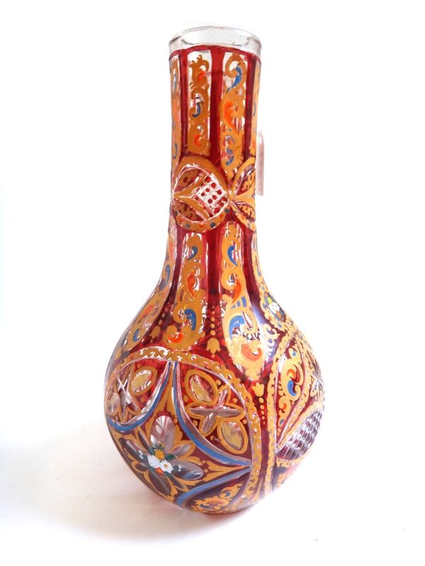 A Bohemian clear and ruby flashed glass hookah base for the Turkish market, late 19th century, of bottle form, cut with diamond and foliate panels and