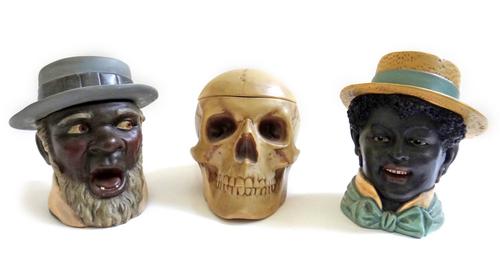 A novelty tobacco jar and cover, 19th century, modelled as a bearded black man in a wide brimmed hat, possibly by B. Bloch of Austria, another similar