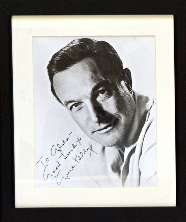 GENE KELLY - mounted & framed head & shoulders b/w portrait, inscribed 'To Aldo - Good Luck, Gene Kelly'; 34 x 29cms. overall, Benham Group authentifi