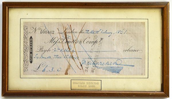 CHARLES DICKENS - a framed Messrs. Coutts & Compy. cheque (13 Feb, 1861), payable to Mr. (?) Chouse for £6.3.0, signed by the author. Illustrated