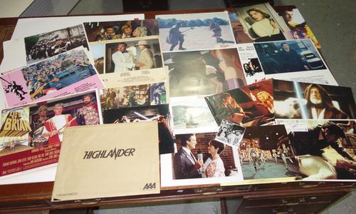 A quantity of film memorabilia; lobby cards including 'Who framed Roger Rabbit', 'Indiana Jones', 'James Bond', 'Highlander', 'Star Wars', 'The Great
