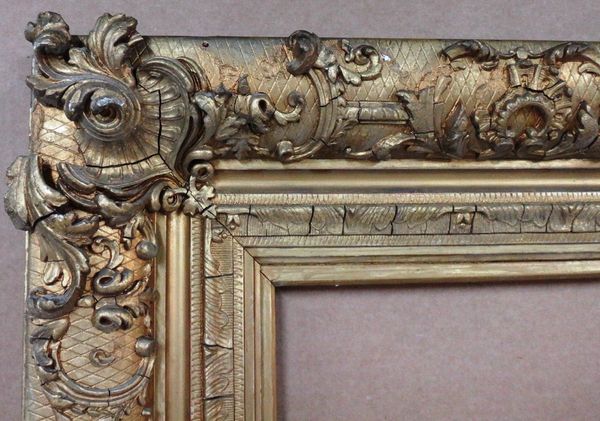 A 19th century gilt plaster frame with foliate decoration, aperture 151cm x 107cm.