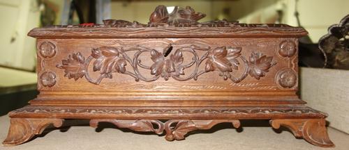 A 19th century Black Forest carved acanthus glove box. CAB