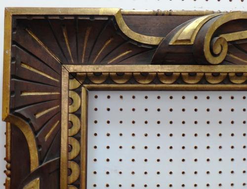 An Italian walnut and parcel gilt frame, aperture 148cm x 130cm. Illustrated