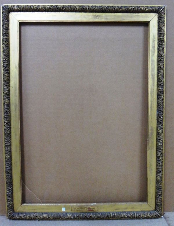 A 19th century and later carved giltwood frame, the aperture 77cm wide x 110cm high.