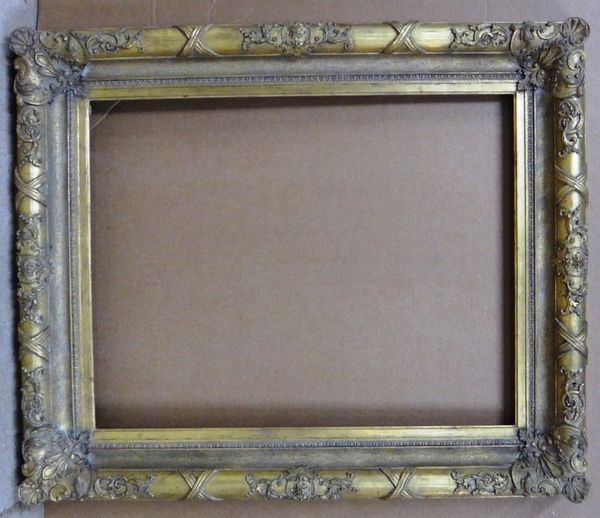 A 19th century and later gilt plaster frame, with foliate and ribbon decoration, the aperture 73cm wide x 92cm high.