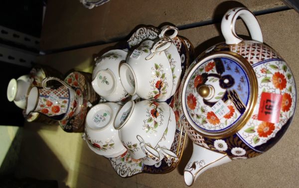 A Wedgwood Imari pattern part tea set, comprising; eight cups, a teapot, a milk jug, a sugar bowl, twelve saucers, twelve side plates and two square t