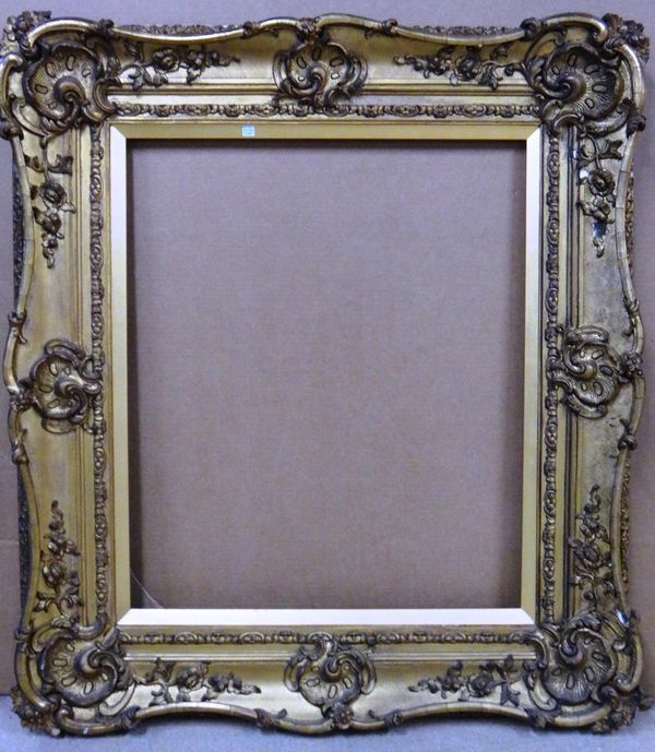 A 19th century gilt plaster swept frame, the aperture 64cm wide x 77cm high. Illustrated
