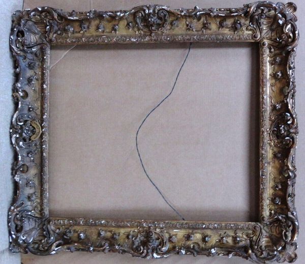 A 19th century carved giltwood swept frame, the aperture 63cm wide x 77cm high.