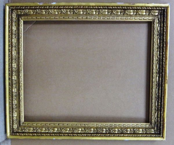 A late 18th/early 19th century carved giltwood frame, with foliate and barleytwist decoration, the aperture 60cm wide x 76cm high.