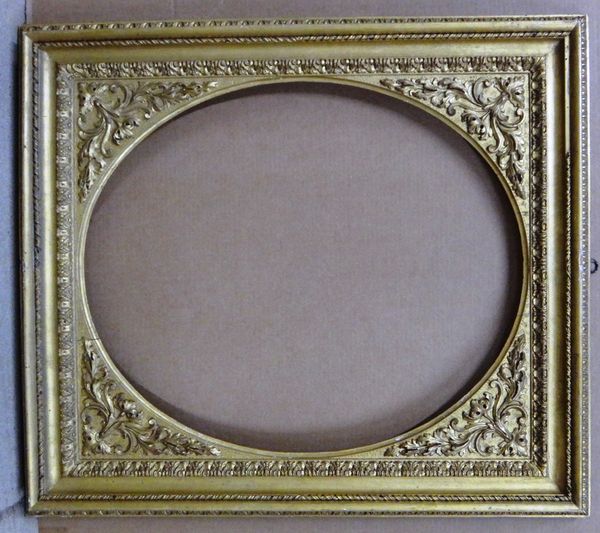 A 20th century gilt plaster frame with oval insert, with foliate, barleytwist and egg and dart decoration, the aperture 62.5cm wide x 72cm high. Illus