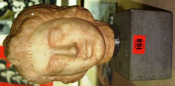 A carved marble bust head of Eros in the Roman style, 27cm high.   ROS