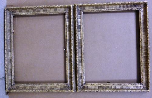 A pair of 20th century gilt plaster frames with reeded and foliate decoration, each aperture 63cm wide x 49.5cm high. (2)
