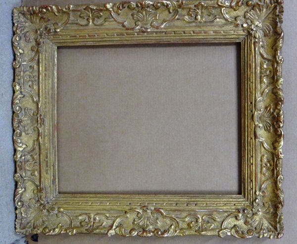 A 20th century Continental gilt plaster frame, the aperture 45.5cm wide x 57cm high.