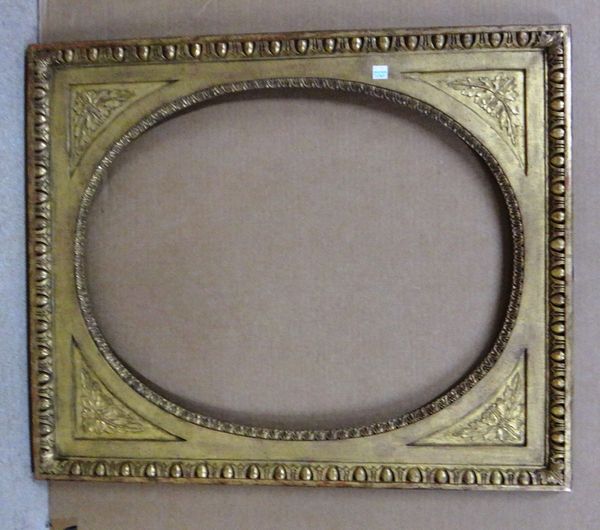 A 20th century gilt plaster frame with egg and dart mouldings and oval insert, the aperture 47cm wide x 60cm high.