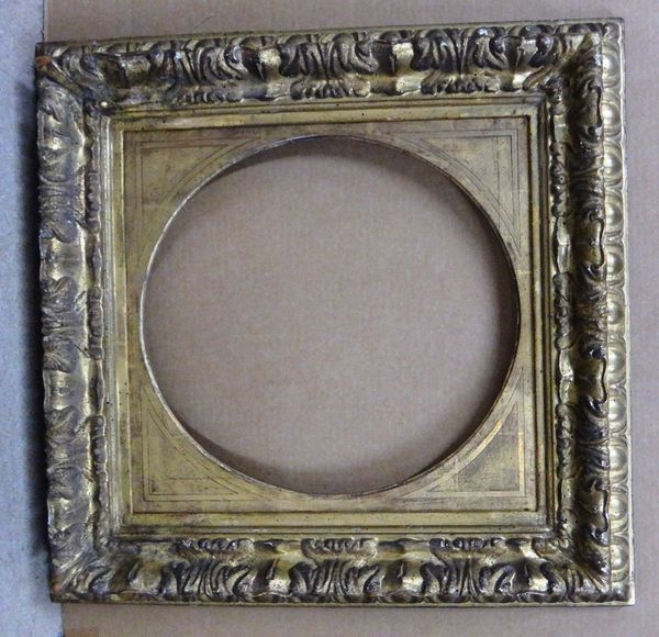 An 18th century and later carved giltwood frame with egg and dart mouldings and oval insert, the aperture 41cm wide x 44cm high.