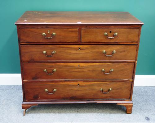 A George III mahogany chest of two short and three long graduated drawers, on bracket feet, 108cm wide.