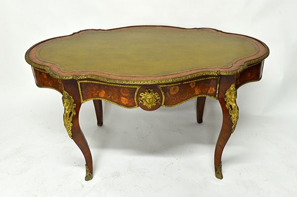 A late 19th century French gilt metal mounted marquetry inlaid bureau plat, the leather inset shaped top over single frieze drawer on four cabriole su