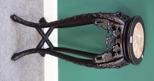 A 20th century Chinese urn stand, the circular marble inset top over a carved hardwood base with four cabriole supports, 35cm wide.