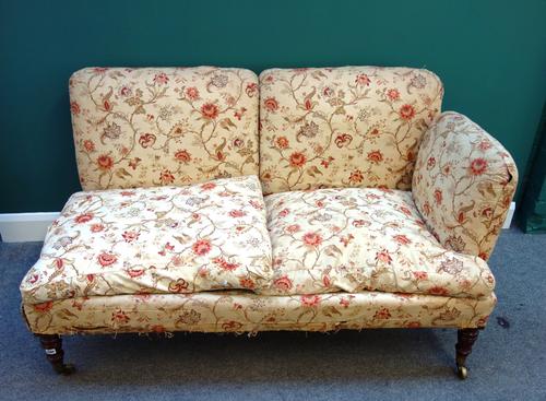 Howard & Sons; a 19th century mahogany framed single arm sofa, on turned supports, 145cm wide, the castors stamped 'Howard & Son', the back legs stamp