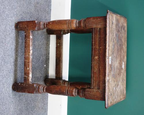 A 17th century and later oak joint stool, on turned supports united by perimeter stretcher, 46cm wide.
