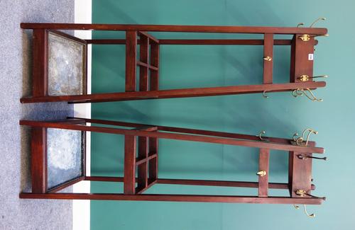 A pair of mid-20th century mahogany coat/ umbrella stands, each of obelisk form, mounted with various hooks above four section umbrella stand, 51cm wi