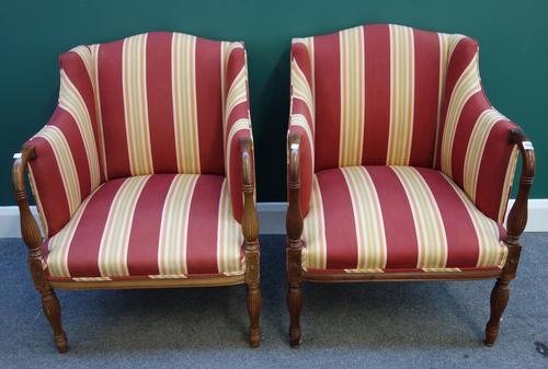 A pair of early 19th century style shaped square back tub chairs, on baluster reeded mahogany supports, (2).