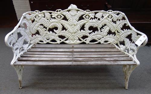 A Coalbrookdale design white painted aluminium garden bench, in the 'Fern and Berry' pattern, with slatted wood seat, 150cm wide.