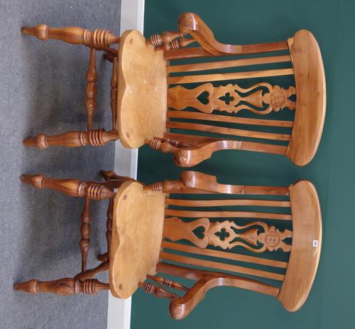 A pair of yew wood kitchen scullery armchairs, with shaped carved and pierced splat, detailed with letters 'E' and 'A', over solid seat, on turned sup