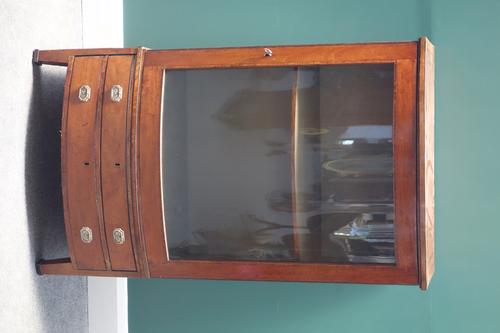 A 19th century satinwood bow front display cabinet, with double drawer base, on bracket feet, 74cm wide.