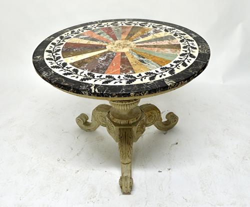 An early 19th century style centre table, the stellar inlaid specimen marble circular top with chased oak leaf border, on a grey painted carved base,