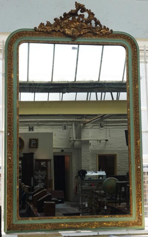 A 19th century later green and gilt decorated over mantel mirror with 'C' scroll crest and moulded frame, 110cm wide x 175cm high.