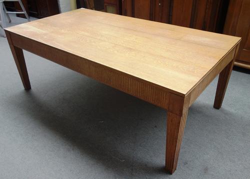 A 20th century rectangular oak dining table, with fluted frieze and tapering square supports, 115cm wide x 213cm long.