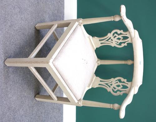 An 18th century and later painted corner chair, with pierced double splat back, on block supports.
