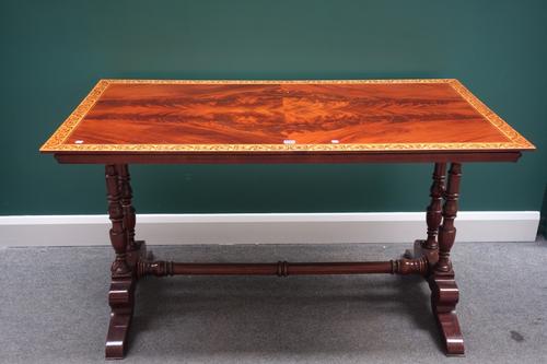 A 19th century Italian marquetry inlaid rectangular mahogany centre table, on four turned columns and four downswept supports, 137cm x 73cm.