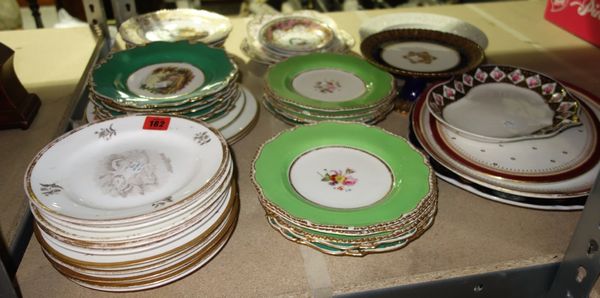 A quantity of ceramic plates, including a pair of Spode plates painted with castles, a Derby gilt and purple plate, Copeland Spode plates decorated wi
