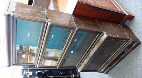'The Globe Wernicke Co. Ltd'; a four tier oak bookcase, with three glazed sections and blind panel lower, over single drawer base, 87cm wide.