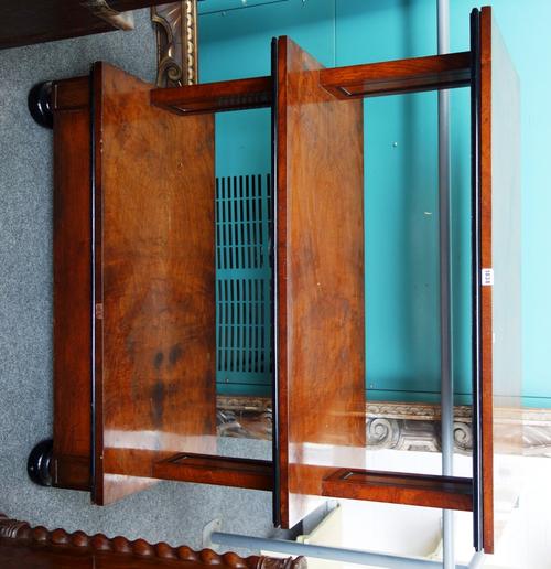 A George IV pollard oak and ebonised rectangular three tier buffet with single drawer base on trestle end standards, 107cm wide.