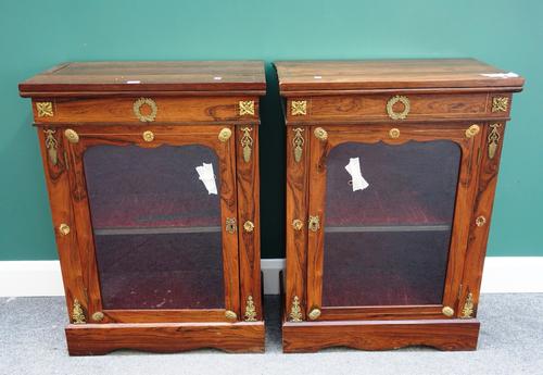 A pair of 19th century Empire style gilt metal mounted pier cabinets, each with single glazed door, on plinth base, 65cm wide.