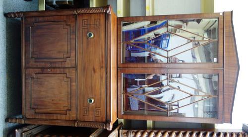 A Regency mahogany secretaire bookcase, the pair of astragal glazed doors, over fitted drawer and a pair of cupboards, on outstepped reeded supports,