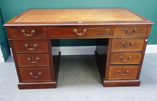 A 19th century mahogany pedestal desk, with nine drawers about the knee, on plinth base, 135cm wide.
