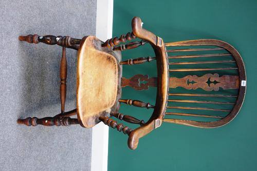 A Victorian ash and elm tub back Windsor chair, on turned supports.