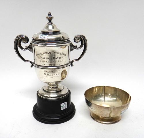 A 19th century console table, the rounded rectangular white marble top over a figured walnut base, with a pair of scroll supports, united by concave p
