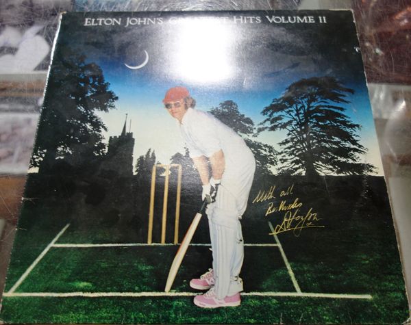 An Elton John 'Greatest Hits' record signed in gold pen, Vol II. All potential purchasers should satisfy themselves with authenticity of signatures. C