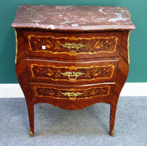 A Louis XV style petite commode, the serpentine marble top over a marquetry inlaid gilt metal mounted bombe three drawer base, on splayed feet, 66cm w