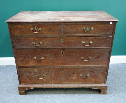 An 18th century oak chest of two short and three long graduated drawers, on bracket feet, 109cm wide.