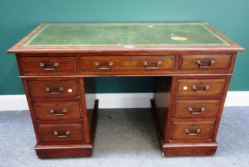 A Victorian mahogany pedestal desk with nine drawers about the knee on plinth base, 122cm wide.